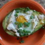 baked egg in an avocado cup